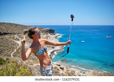 Young Woman With Gopro Camera On Mediterranean Coast In Summer