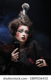 Young woman with gothic make-up and crazy hair-style. Creative fashion masquerade. Party time.