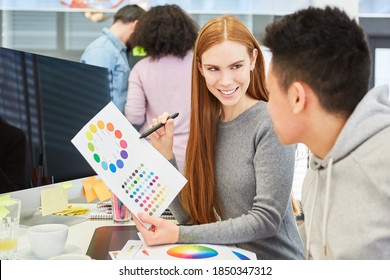 Young Woman As A Graphic Designer With A Color Wheel Has A Suggestion For Color Design