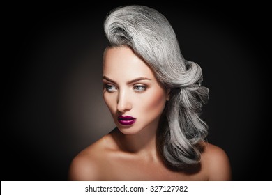 Young Woman With Grey Hair Color And Beautiful Makeup In Studio On Black Background