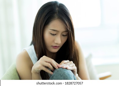 Young woman grooming her nails