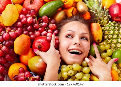 Young Woman In Group Of Fruit. Healthcare.