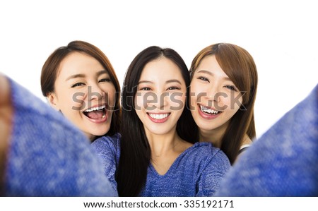 young woman group having fun together and taking selfie