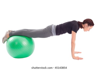 Young Woman With Gym Ball Doing Pushup Exercise, Isolated On White Background.