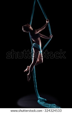 Similar – Rückenansicht einer nicht erkennbaren Frau in Aerial Dance Pose auf dem Kopf stehend