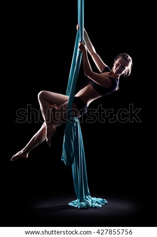 Similar – Rückenansicht einer nicht erkennbaren Frau in Aerial Dance Pose auf dem Kopf stehend