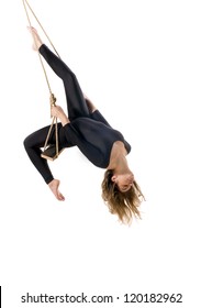 Young woman gymnast on rope on white  background