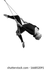 Young woman gymnast on rope on white background , Black and white