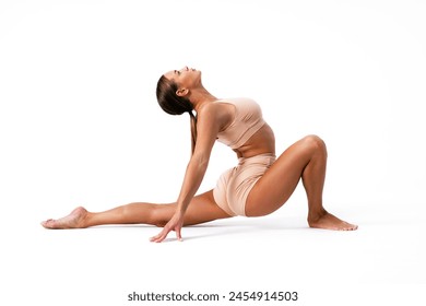 Young woman gymnast stretching on white background - Powered by Shutterstock