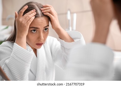Young Woman With Hair Loss Problem  At Home