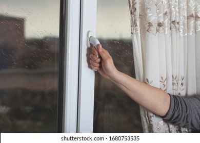 Young Woman Hand Opening The Window Door