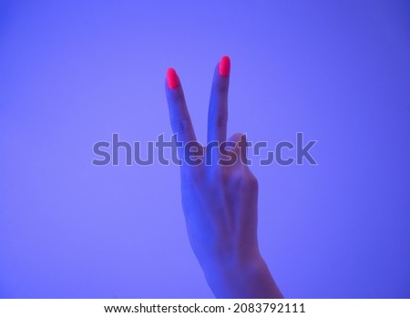 Similar – Image, Stock Photo Woman making a rock sign with her hand