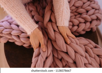 Young Woman Hands Grab Pink Giant, Large Warm Merino Wool Plaid Blanket. Cozy Morning