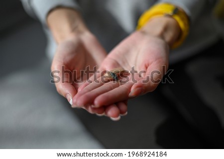 Similar – Image, Stock Photo Hand holding an acoustic guitar with black background with a dramatic and cinematic tone in chiaroscuro