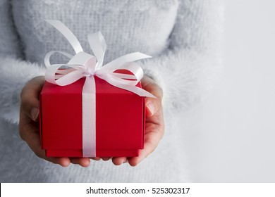 Young Woman Hands Holding Red Gift Box 