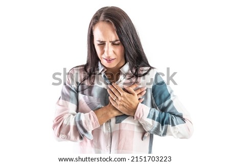 Young woman with hands on chest with heart arrhythmia. Isolated on white.