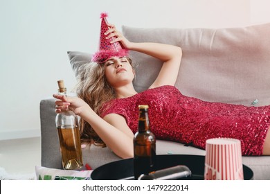 Young Woman With Hangover After Party At Home