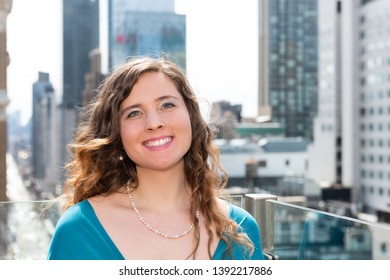 Young Woman Happy Smiling On Rooftop Restaurant In New York City NYC At Wedding Reception With Cityscape Skyscrapers And Closeup Of Face