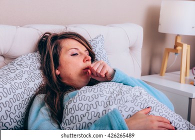 Young woman has a bad cough - Shutterstock ID 426265489