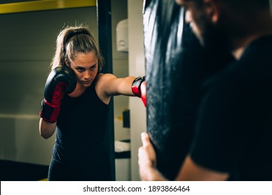 Young Woman Has Boxing Training