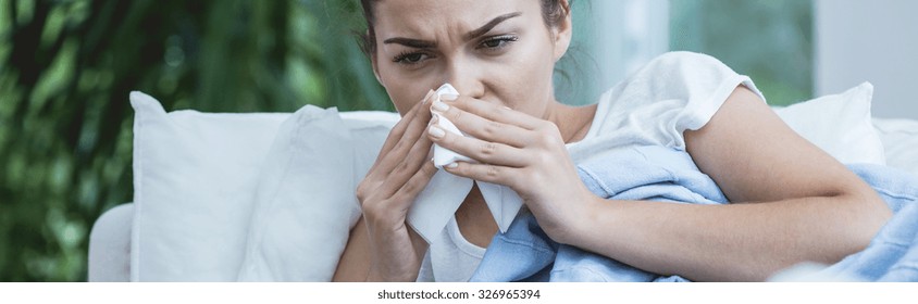 Young Woman Has Got Very Stuffy Nose 