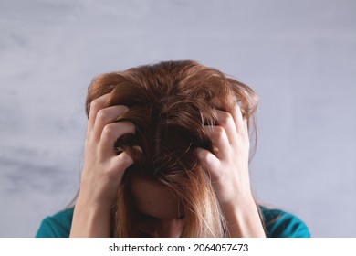 A Young Woman Has An Itchy Head