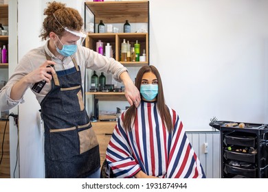 Young Woman Have Hair Cutting At Hair Stylist During Pandemic Isolation, They Both Wear Protective Equipment. Hair Dresser Working With A Face Mask During Coronavirus Quarantine