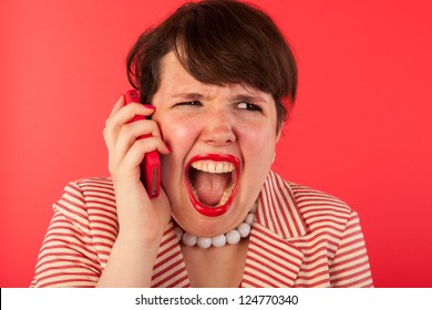 Young Woman Is Having An Angry Phone Call At The Smartphone