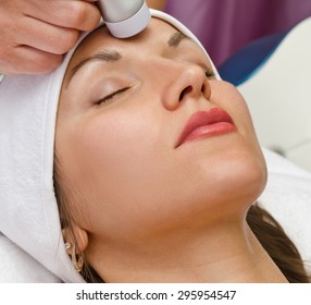 Young woman having facial treatment 
