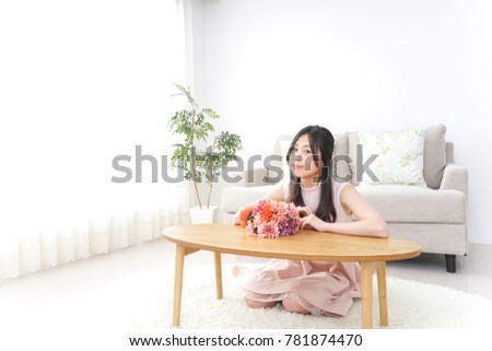 Young woman having flower bouquet