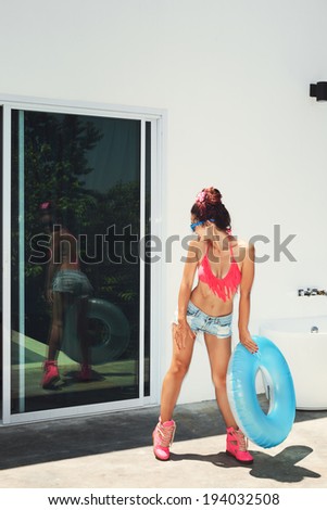 Similar – Surfer woman with top and bikini holding surfboard