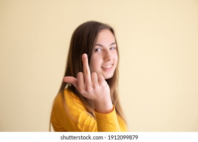 Young woman having fun and showing a finger - Shutterstock ID 1912099879