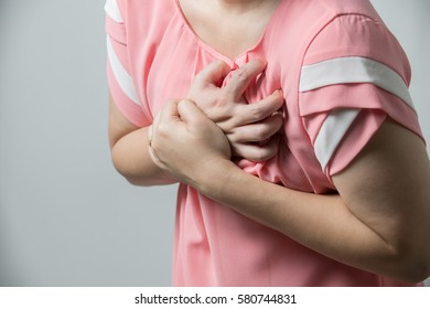 Young Woman Having Heart Attack