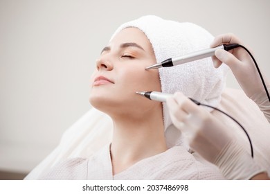 Young Woman Having Micro Current Galvanic Facial Treatment With Electrodes For Lifting Face. Concept Preventing Acne And Oily Skin Problems.