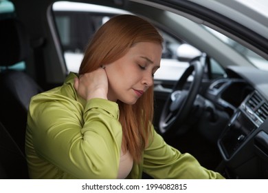 Young Woman Having Neck Pain Or Whiplash Injury After Car Accident