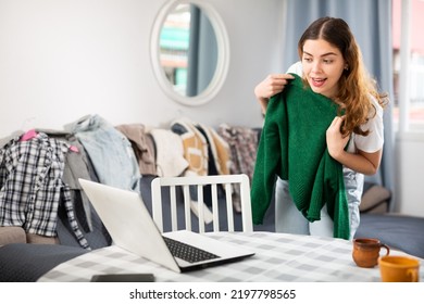 Young Woman Having Online Consultation With Personal Fashion Stylist About Her Wardrobe