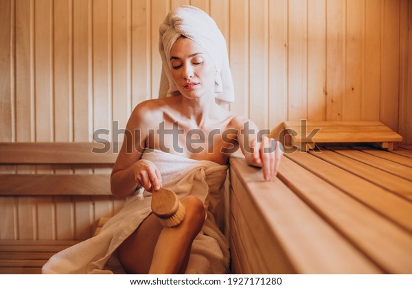 Young woman having rest\
in sauna alone