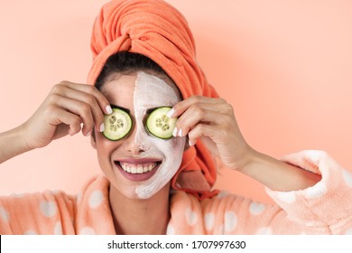 Young Woman Having Skin Care Spa Day At Home - Happy Girl Applying Cucumber Facial Cleanser Mask Portrait - Healthy Beauty Clean Alternative Treatment And Cosmetology Products Concept 