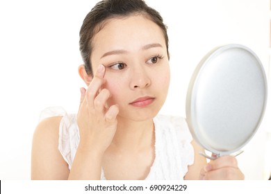 Young woman having skin problems - Shutterstock ID 690924229