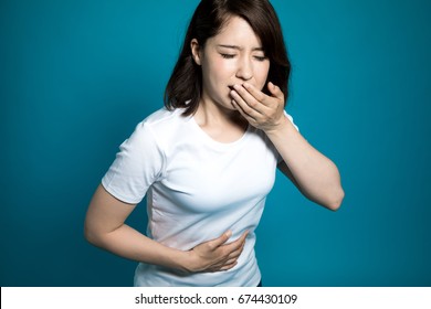 Young Woman Having A Stomachache And Being Going To Vomit.