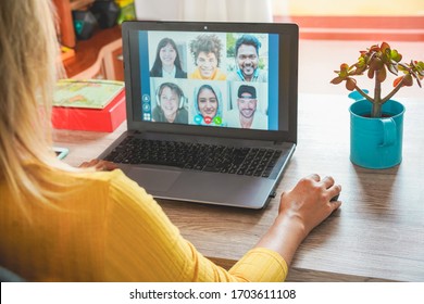 Young Woman Having A Video Call With Multiracial Friends During Isolation Quarantine - Group Of People Having Fun Chatting Online - Technology And Friendship Concept - Focus On Right Hand