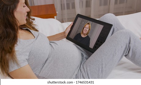 Young Woman Having Video Call Via Tablet Talking To Mom. Friends, Facetime, Online, Internet, Long Distance Communication, Chatting Concept.