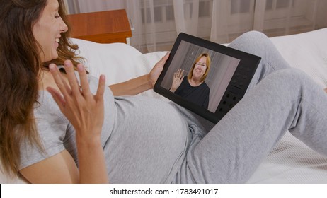 Young Woman Having Video Call Via Tablet Talking To Mom. Friends, Facetime, Online, Internet, Long Distance Communication, Chatting Concept.