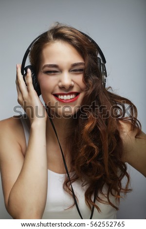 Similar – Blonde woman listening to music with her headphones