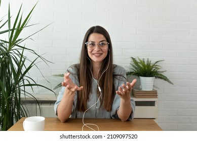 Young woman health care worker psychologist and psychotherapist talking online on web conference video call about how to reduce stress and anxiety in everyday life. Female expert with headphones  - Shutterstock ID 2109097520