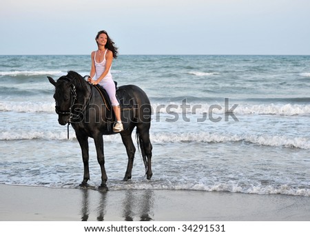 Similar – Junges attraktives Mädchen, das auf einem braunen Pferd am Meer sitzt.