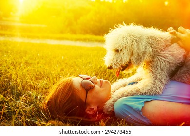 Young Woman And Her Dog Having Fun