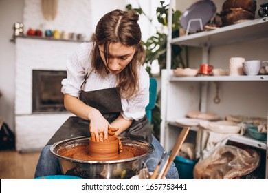 Young Woman At Her Studio On A Pottery Workshop