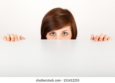 The Young Woman Is Hiding Anxious Behind The Table