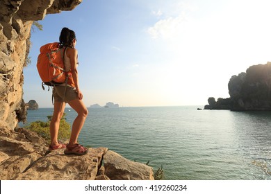 Young Woman Hiker Enjoy The View On Sunset Seaside